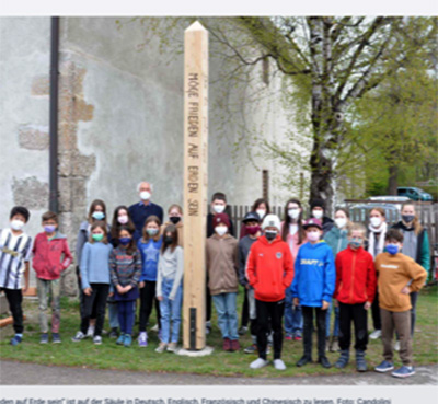Montessori Students build first Peace Pole in Town. Innsbruck, Austria