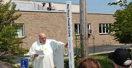 Peace Pole planted at St. Bernadette Catholic Church in Orchard Park, NY – USA